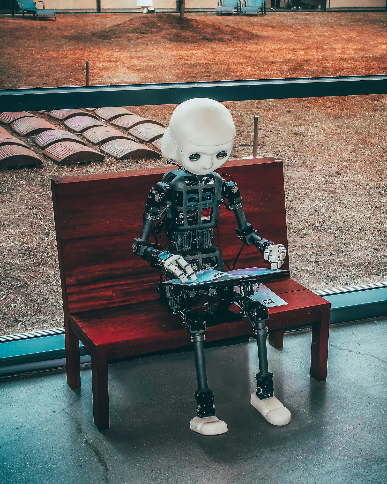 Robot hand and human hand illustrating AI creation workflow